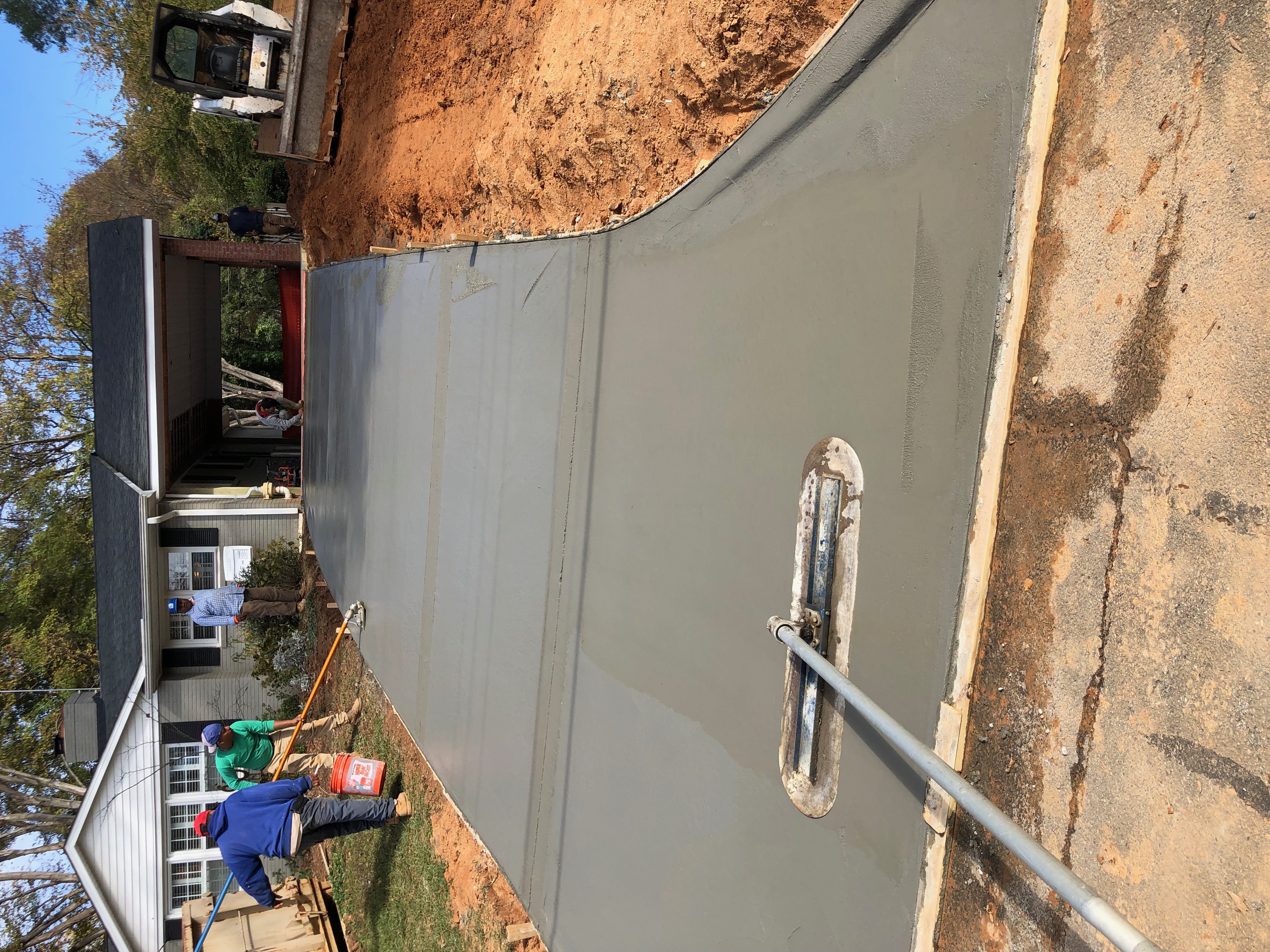 Driveway concrete pour with crew